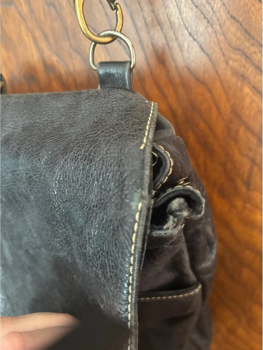 Black Leather Crossbody Backpack with Buckle Closure